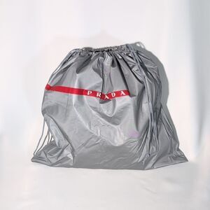 Prada Silver Drawstring Bag with Red Accent (plastic)